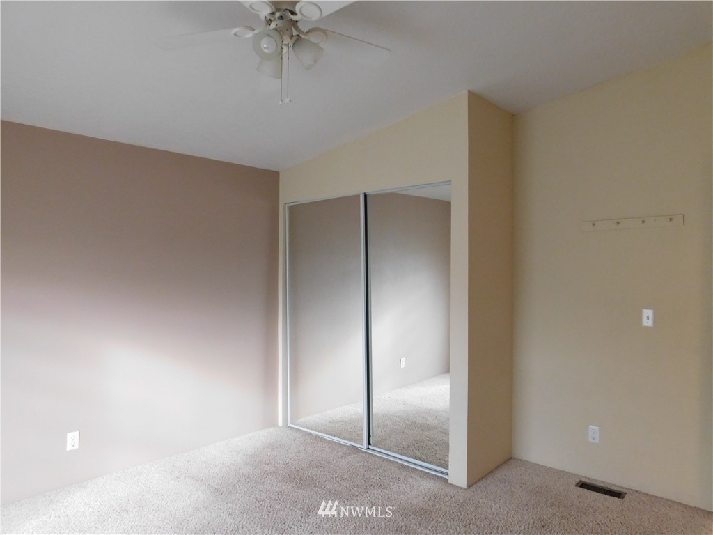 18022 Lawton Lane Southwest Rochester, WA 98579 - Photo 23 of 25 an empty room with a ceiling fan