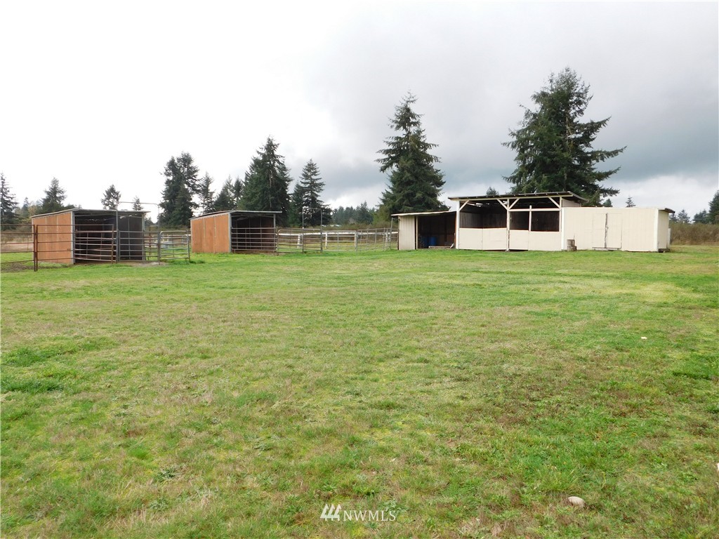 18022 Lawton Lane Southwest Rochester, WA 98579 - Photo 4 of 25 a house with a yard