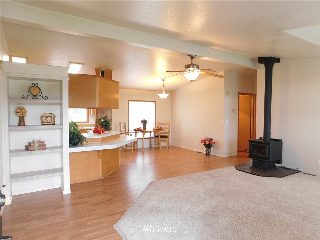 18022 Lawton Lane Southwest Rochester, WA 98579 - Photo 9 of 25 a living room with furniture and a wooden floor