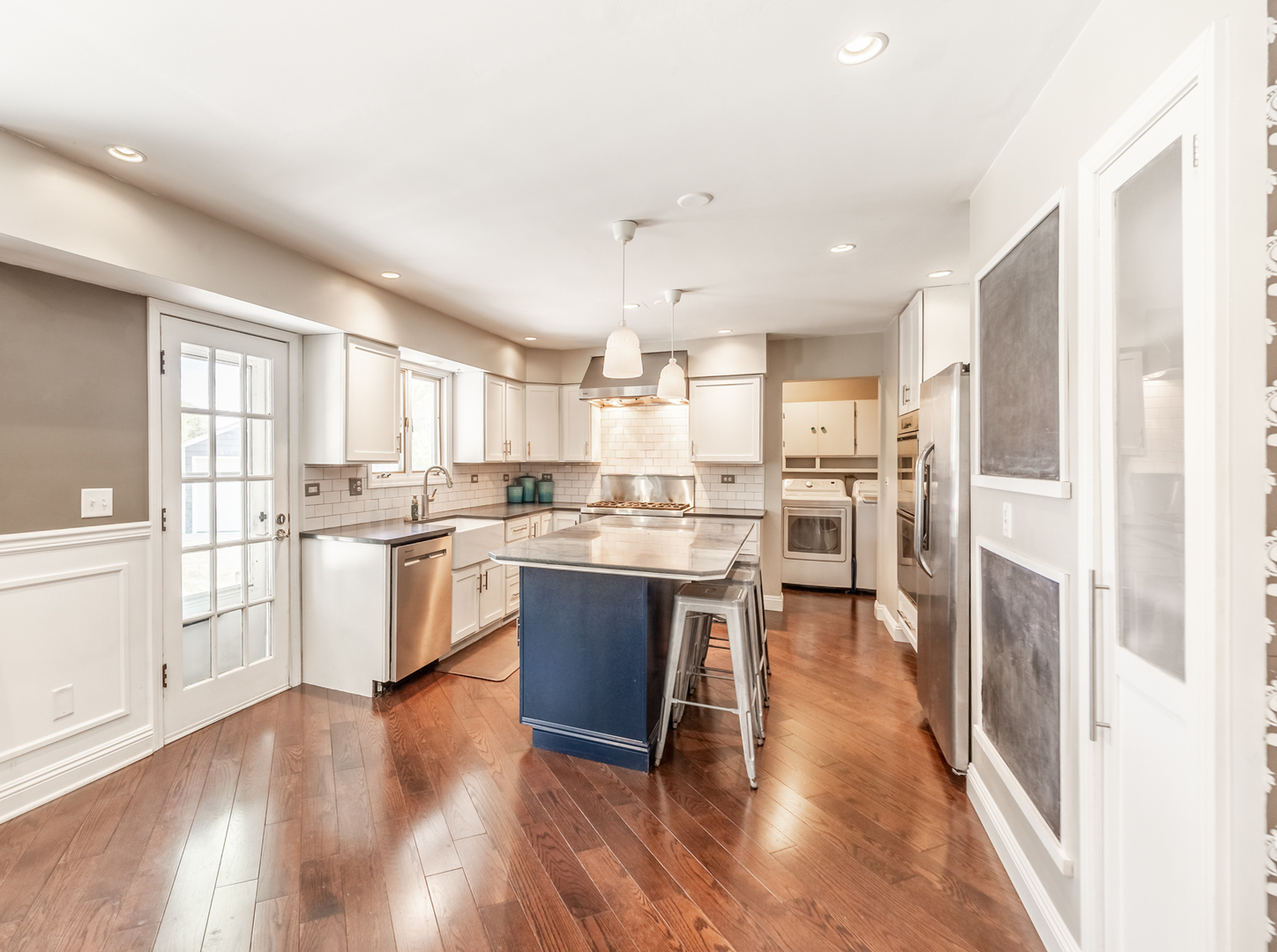 1223 Ridgeway Drive Elgin, IL 60123 - Photo 12 of 40 a kitchen with a refrigerator and white cabinets