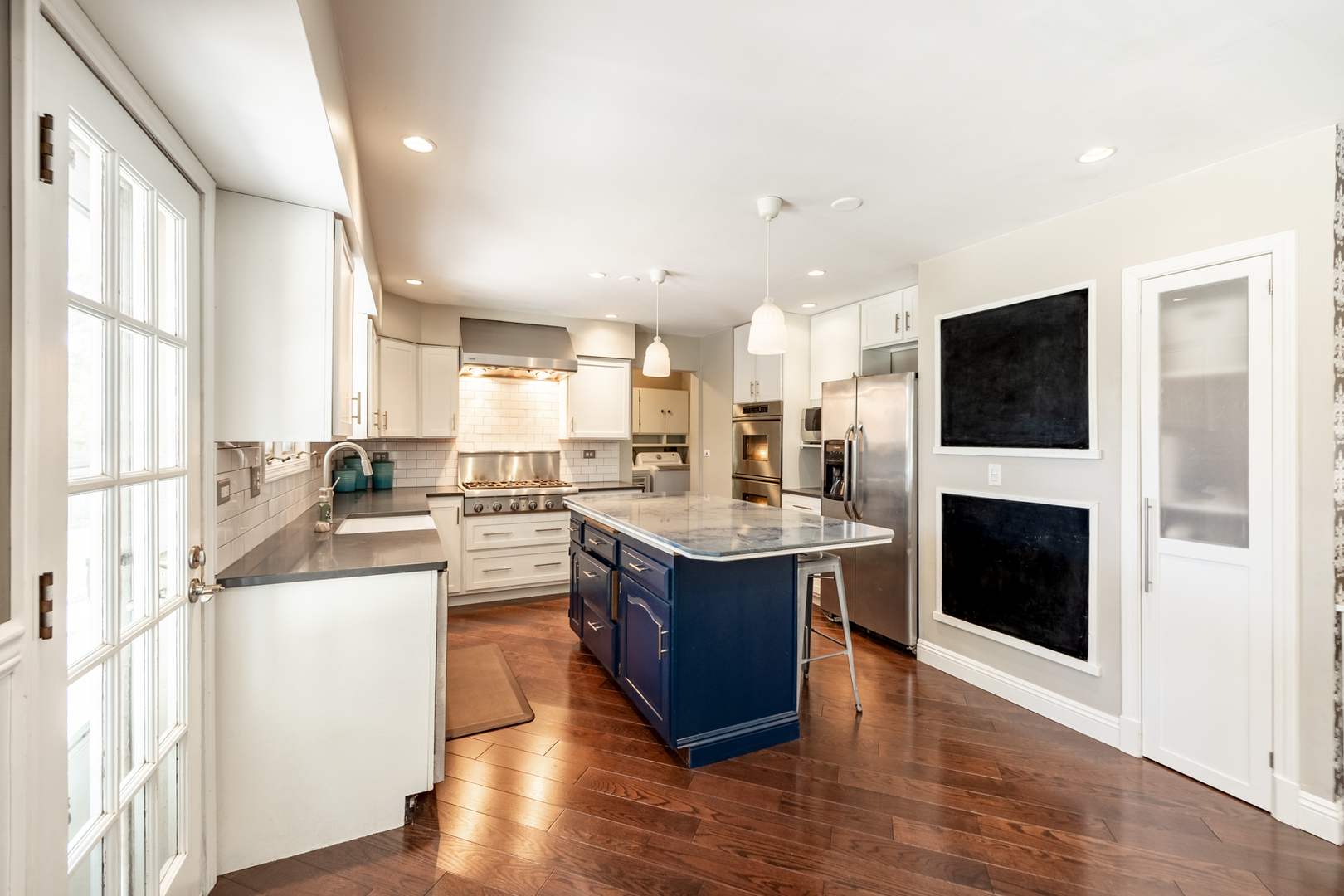 1223 Ridgeway Drive Elgin, IL 60123 - Photo 13 of 40 a kitchen with stainless steel appliances granite countertop a stove and a refrigerator