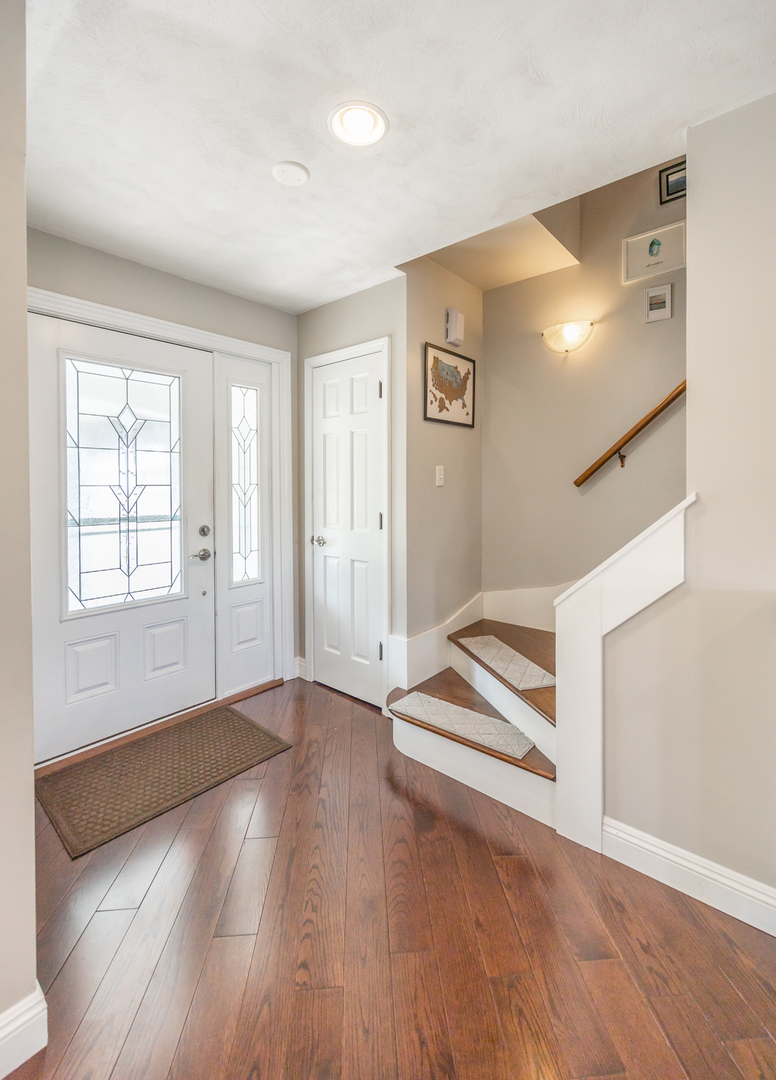 1223 Ridgeway Drive Elgin, IL 60123 - Photo 2 of 40 wooden floor in an empty room with a window
