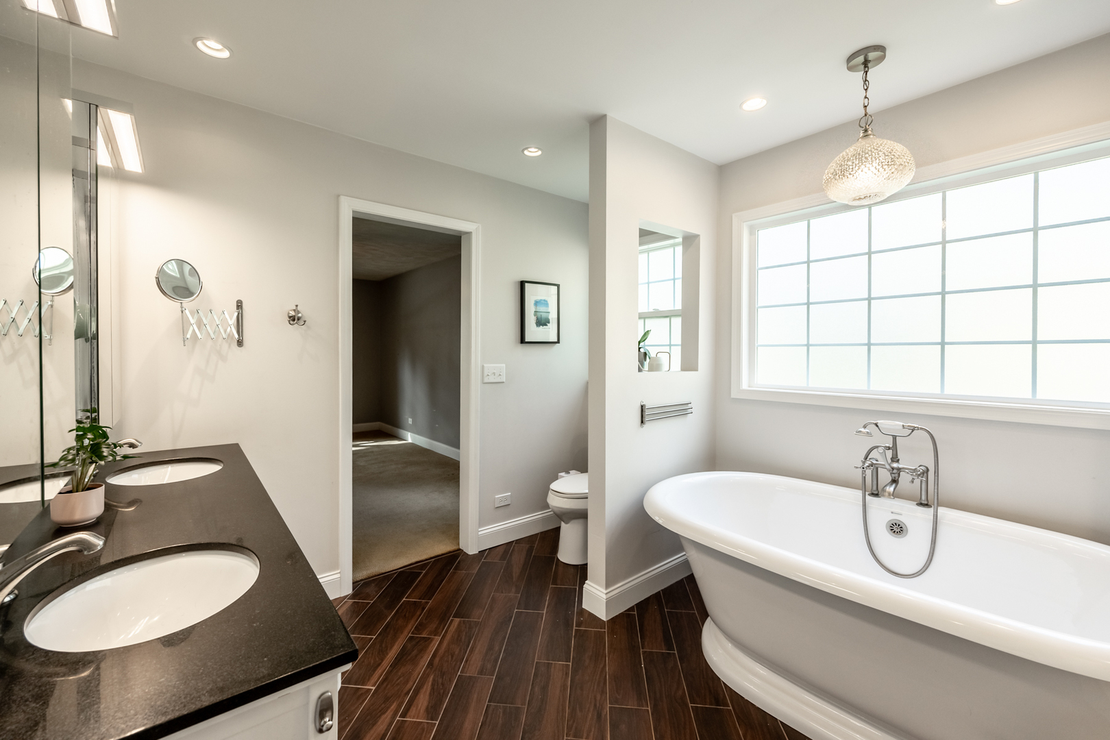 1223 Ridgeway Drive Elgin, IL 60123 - Photo 23 of 40 a bathroom with a sink and a mirror