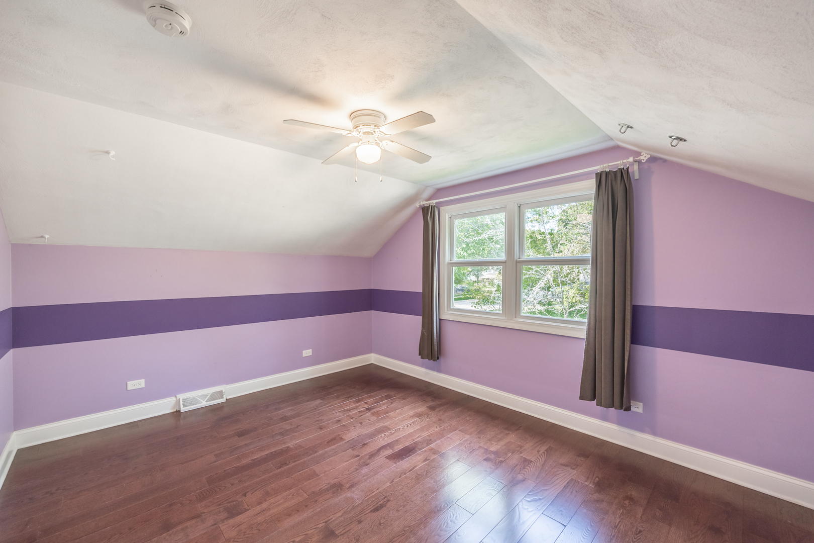 1223 Ridgeway Drive Elgin, IL 60123 - Photo 24 of 40 a view of empty room with wooden floor and fan