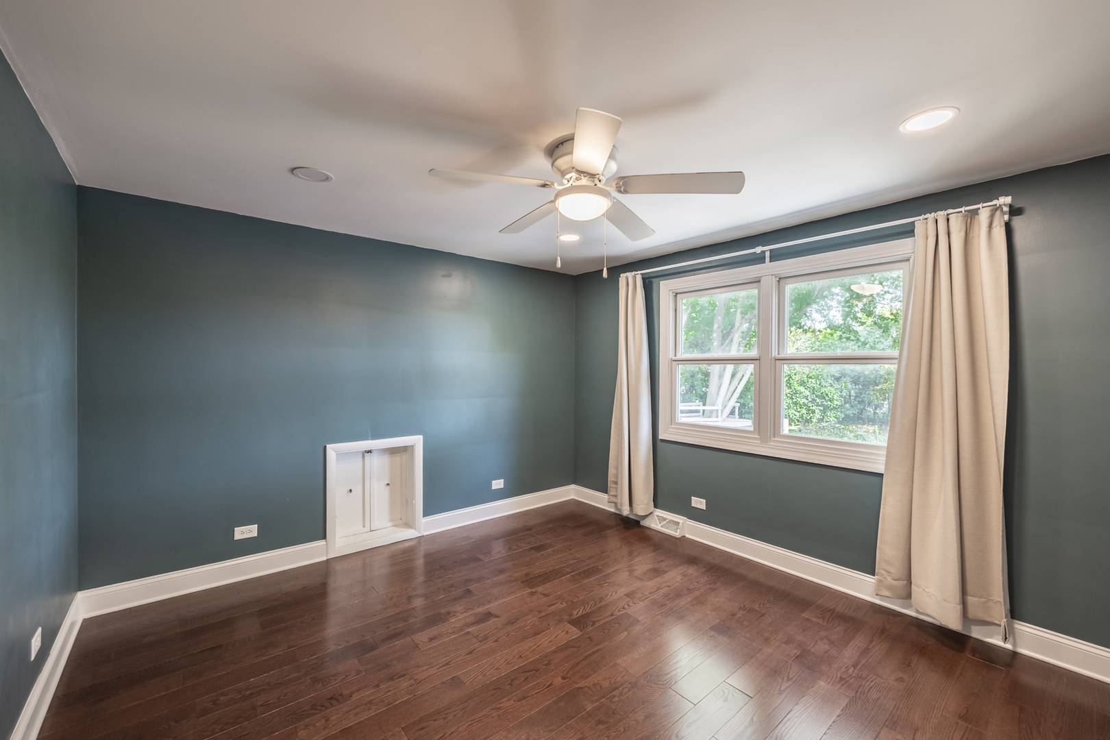 1223 Ridgeway Drive Elgin, IL 60123 - Photo 30 of 40 a view of an empty room with wooden floor and a window