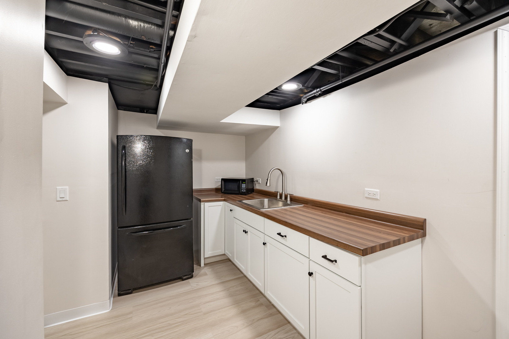 1223 Ridgeway Drive Elgin, IL 60123 - Photo 35 of 40 a kitchen with a refrigerator and countertop