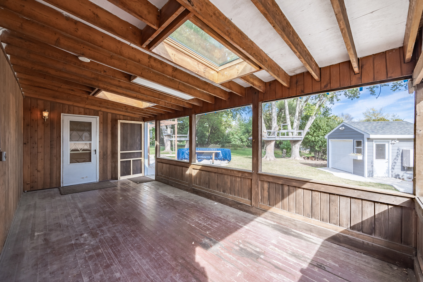 1223 Ridgeway Drive Elgin, IL 60123 - Photo 37 of 40 a view of a porch with wooden floor and roof