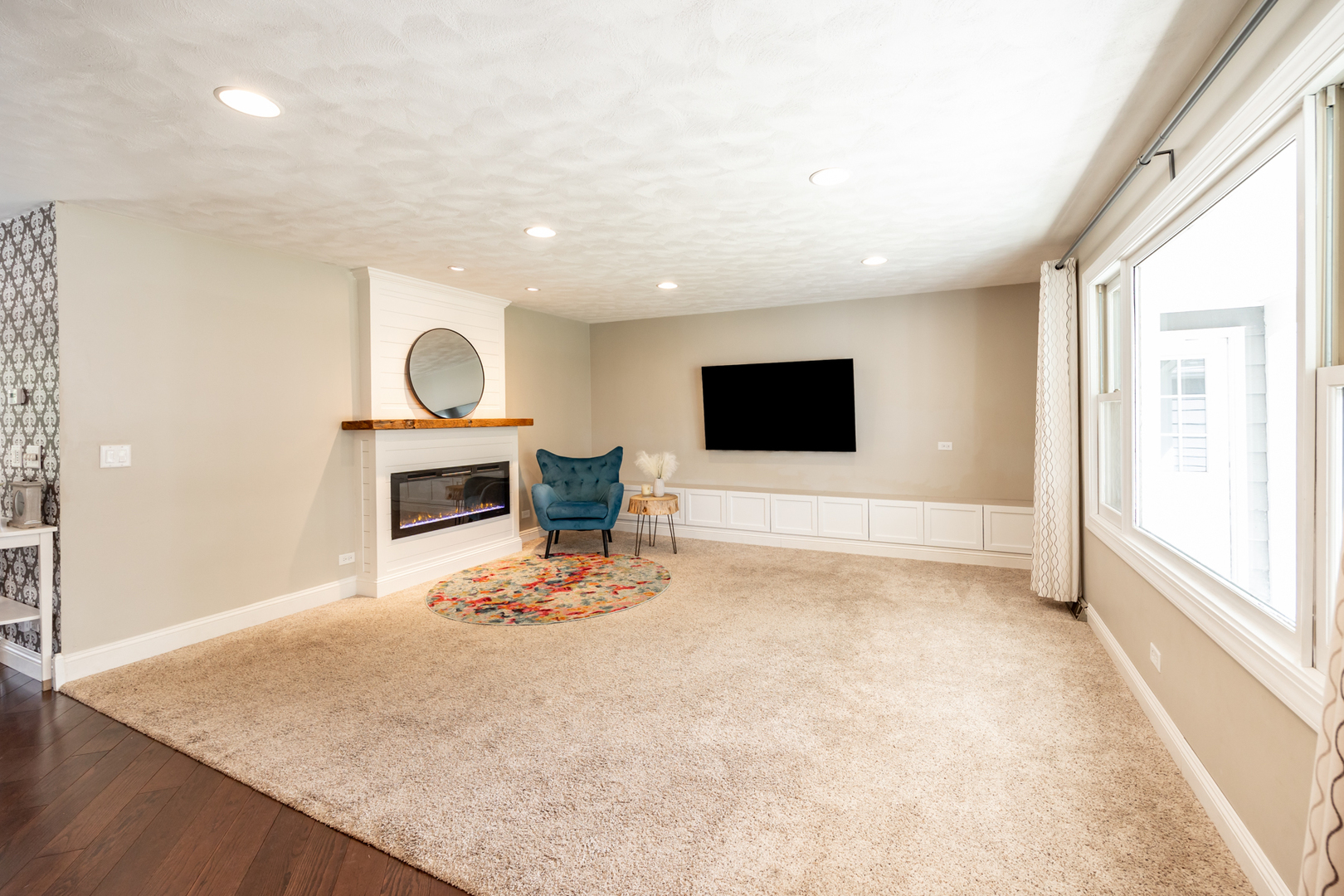 1223 Ridgeway Drive Elgin, IL 60123 - Photo 4 of 40 a view of an empty room with a fireplace and a window