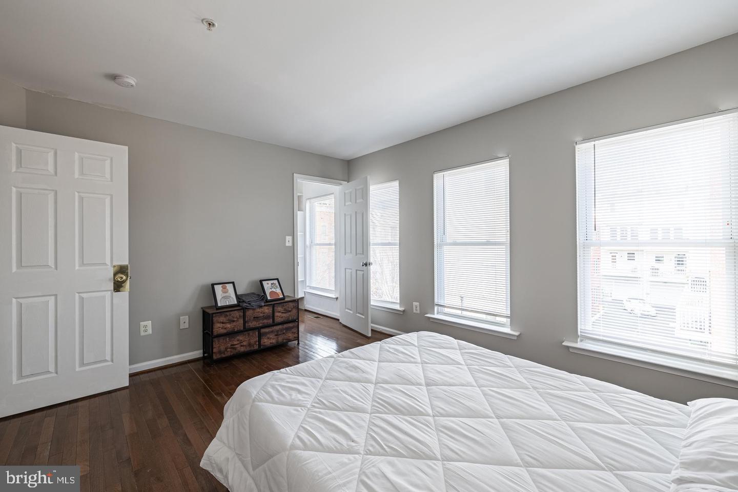 1021 3rd Place Southeast Washington, DC 20003 - Photo 21 of 29 a bedroom with a bed and wooden floor