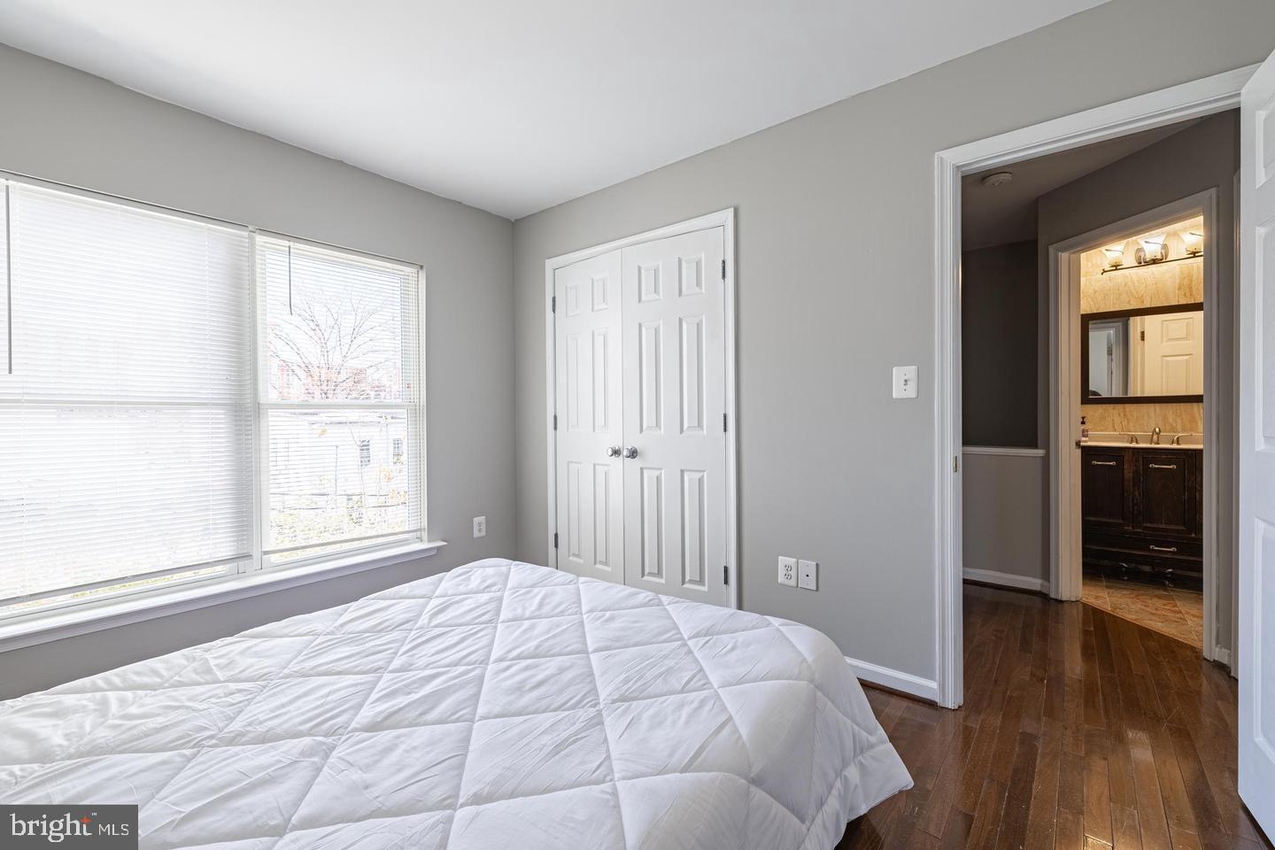 1021 3rd Place Southeast Washington, DC 20003 - Photo 25 of 29 a bedroom with a bed and wooden floor