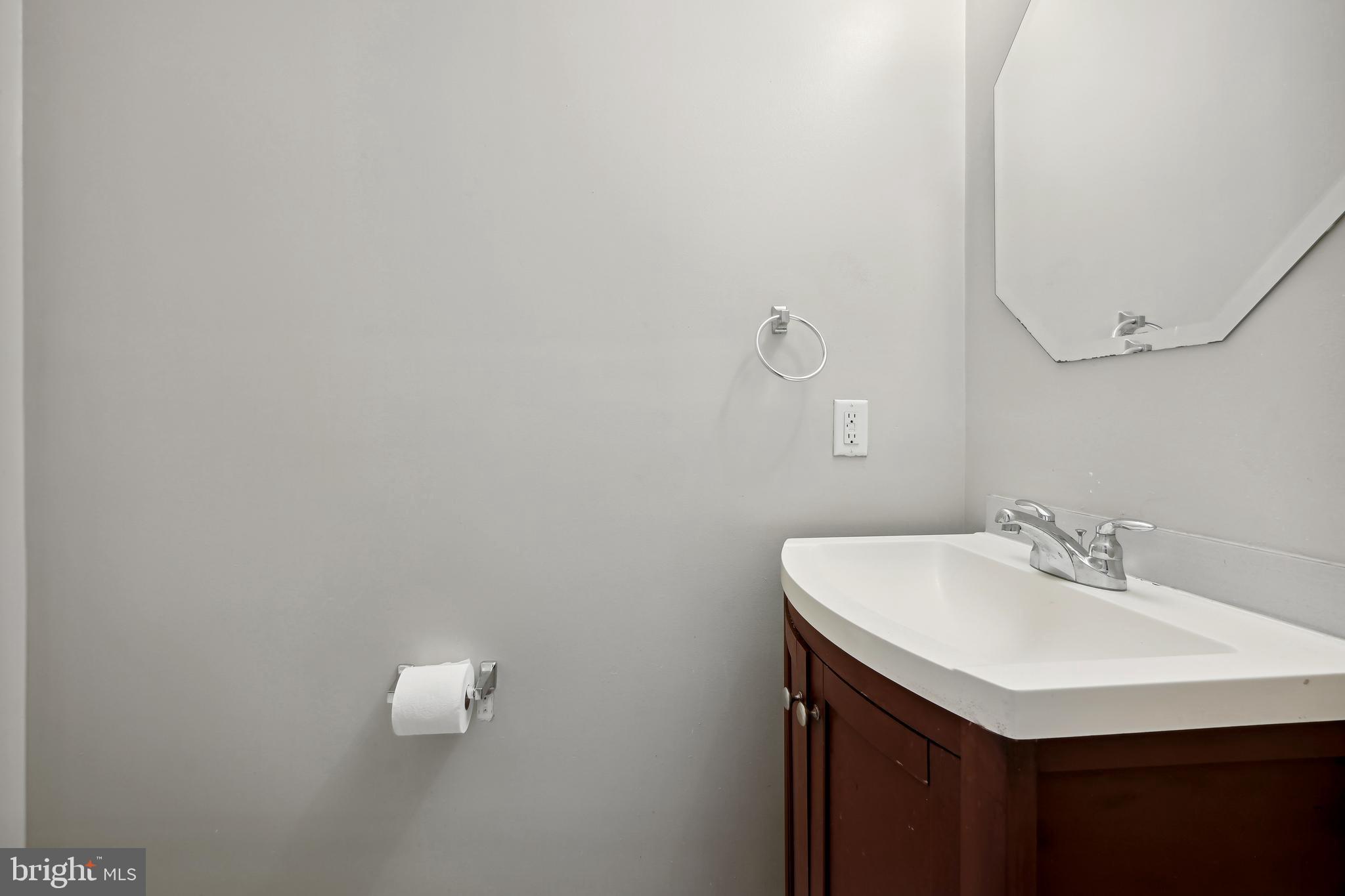 1021 3rd Place Southeast Washington, DC 20003 - Photo 4 of 29 a bathroom with a sink and a mirror