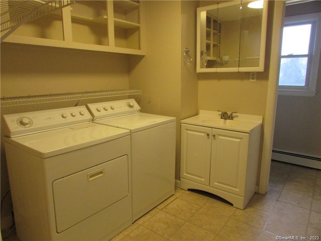 235 Shaker Road Enfield, CT 06082 - Photo 12 of 15 a utility room with dryer and washer