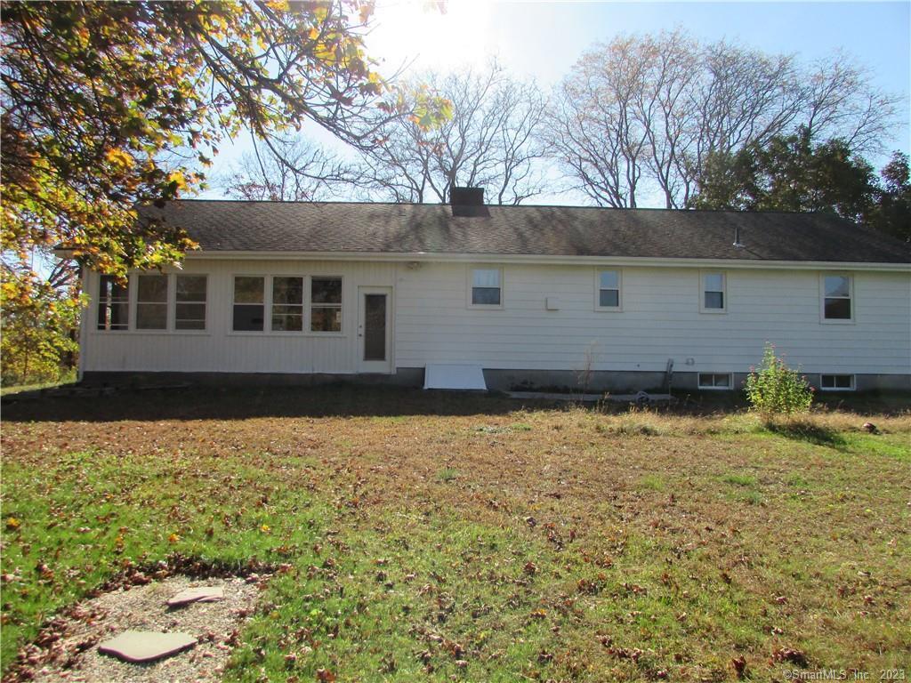 235 Shaker Road Enfield, CT 06082 - Photo 13 of 15 front view of house with a yard
