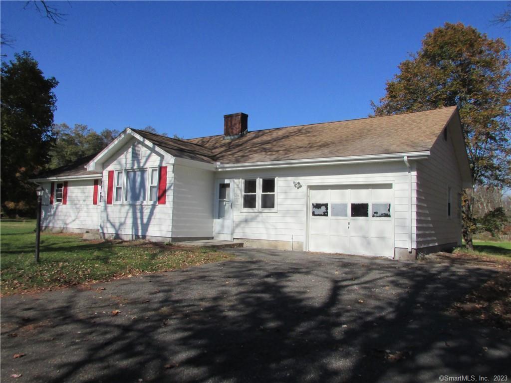 235 Shaker Road Enfield, CT 06082 - Photo 2 of 15 a front view of a house with a yard