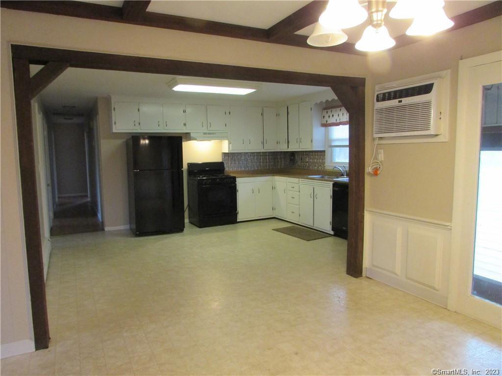 235 Shaker Road Enfield, CT 06082 - Photo 4 of 15 a large bathroom with a large mirror vanity and shower