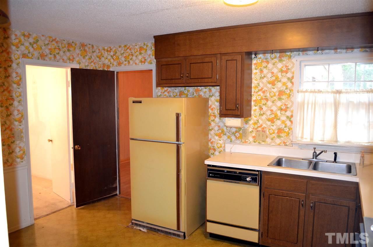 3001 Morningside Drive Raleigh, NC 27607 - Photo 10 of 16 a white refrigerator freezer sitting in a kitchen