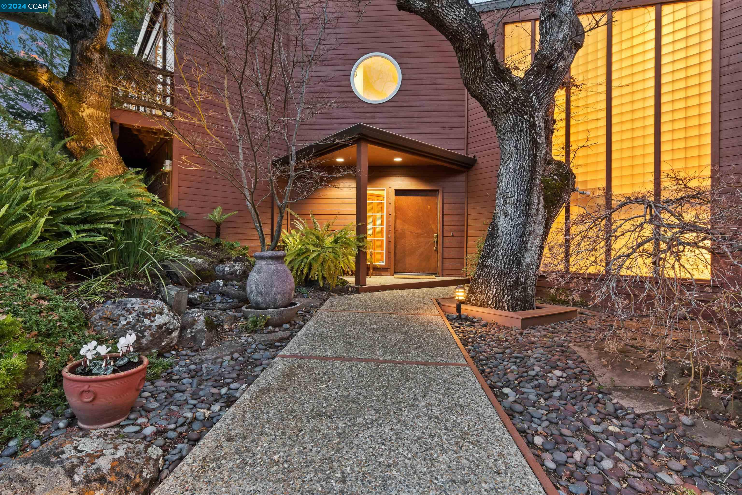 8 Mountainview Lane Lafayette, CA 94549 - Photo 1 of 1 a view of a house with a potted plant and a potted plant