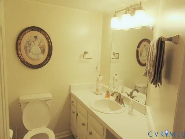 a bathroom with a toilet and a sink