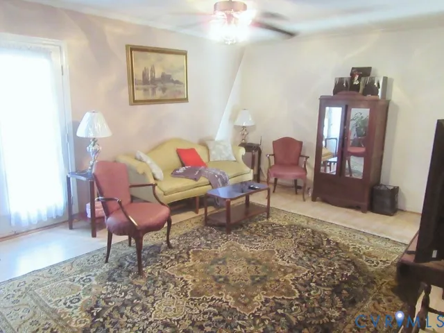 a room with furniture and a potted plant