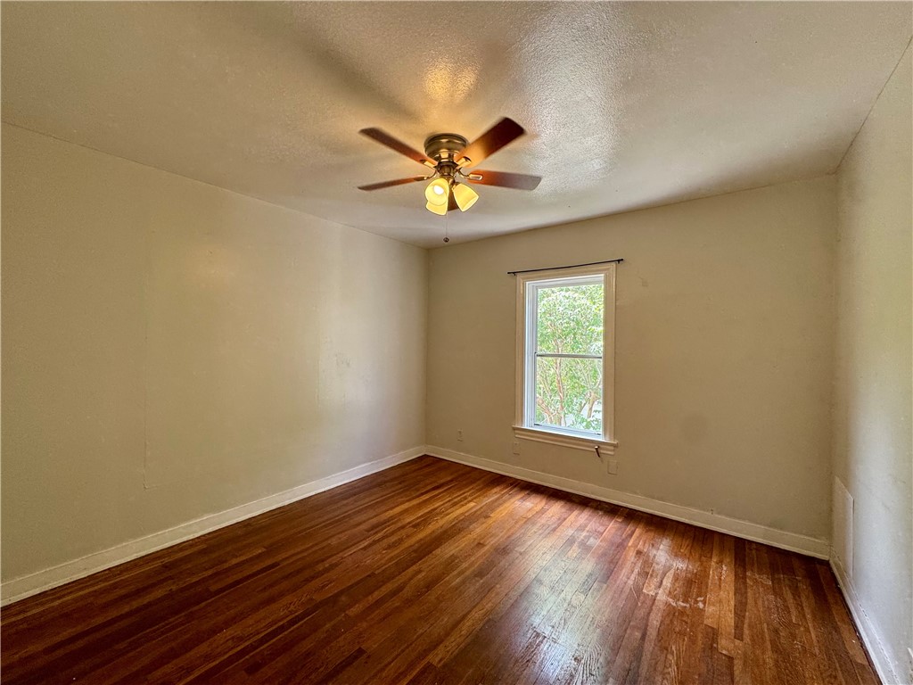 2805 Austin Street, Unit B Corpus Christi, TX 78404 - Photo 11 of 13 a view of empty room with wooden floor and fan