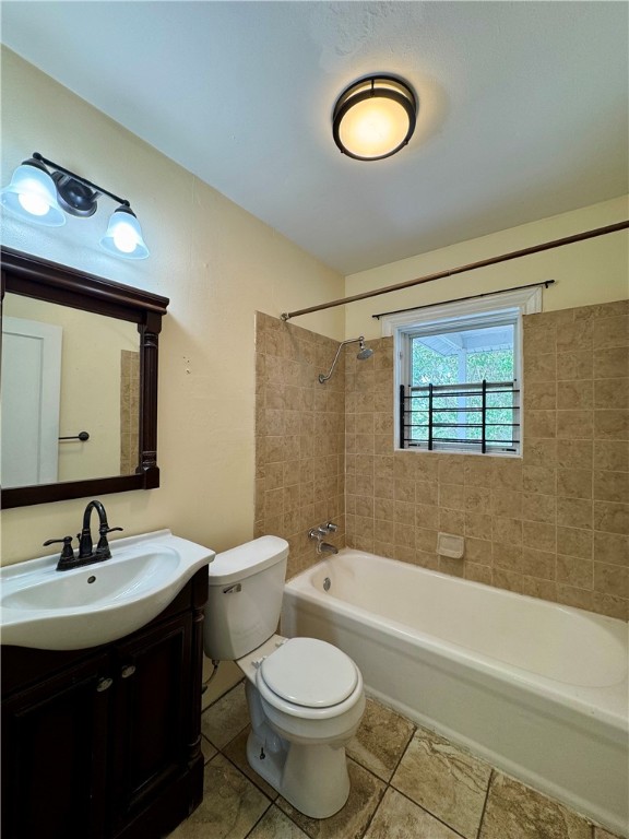 2805 Austin Street, Unit B Corpus Christi, TX 78404 - Photo 12 of 13 a bathroom with a toilet sink and a mirror