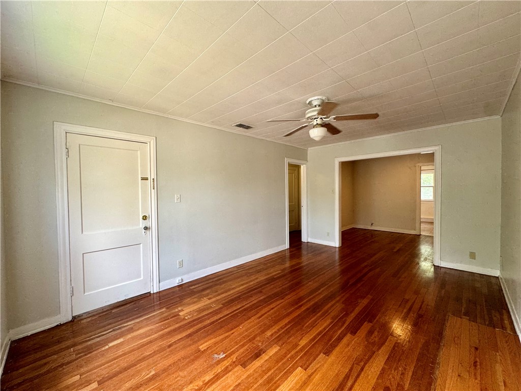 2805 Austin Street, Unit B Corpus Christi, TX 78404 - Photo 4 of 13 a view of a livingroom with wooden floor and a ceiling fan