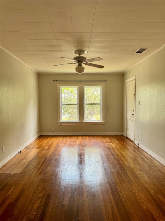 2805 Austin Street, Unit B Corpus Christi, TX 78404 - Photo 5 of 13 a view of an empty room with window and wooden floor