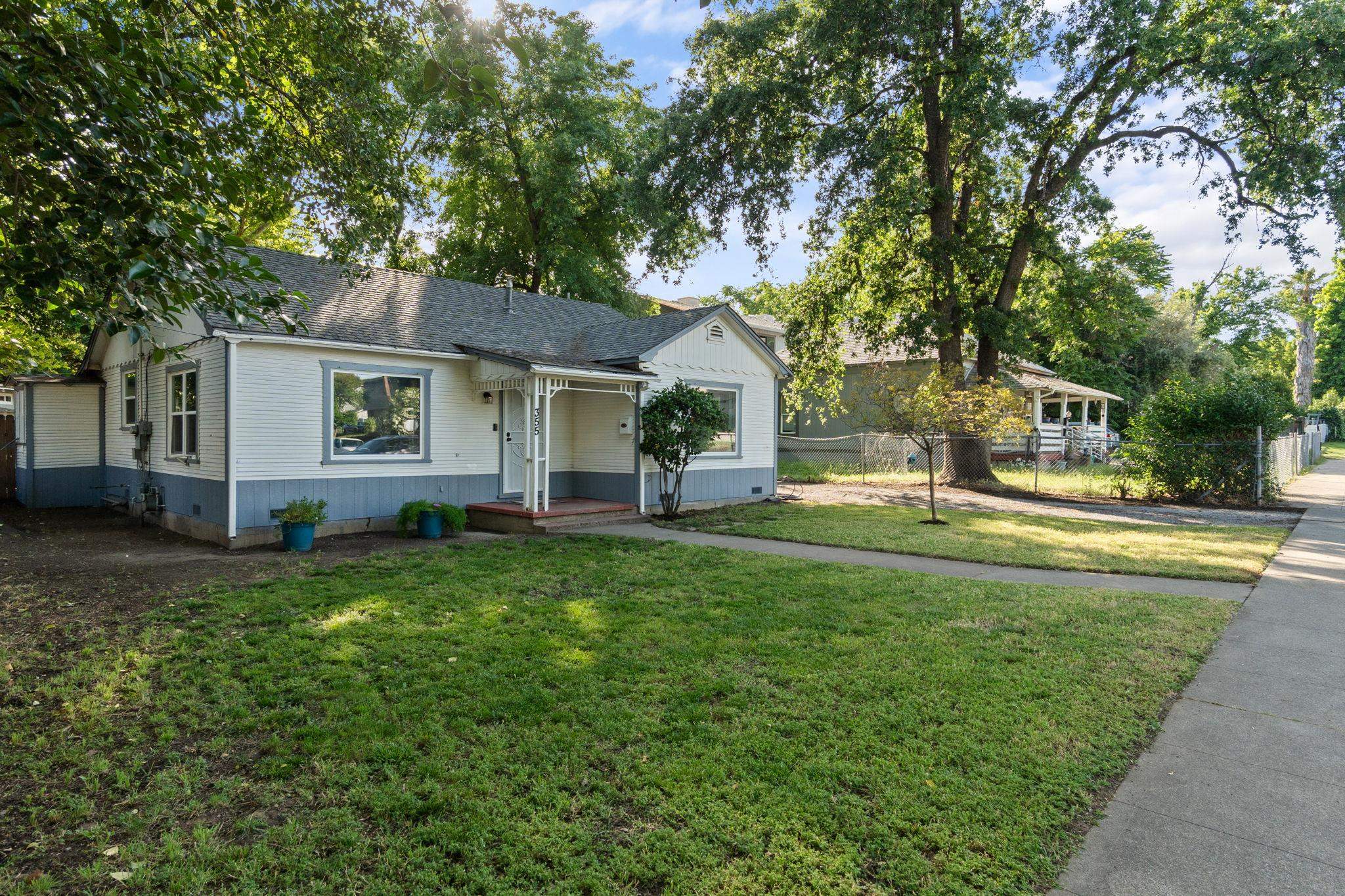 355 Jackson Street Red Bluff, CA 96080 - Photo 23 of 24 a view of a house with a big yard and large tree