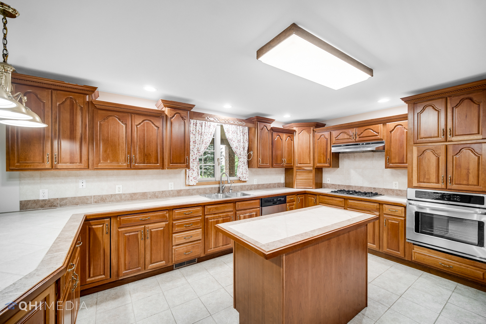 2263 Fox Run Drive Kankakee, IL 60901 - Photo 7 of 34 a kitchen with a sink stove and cabinets