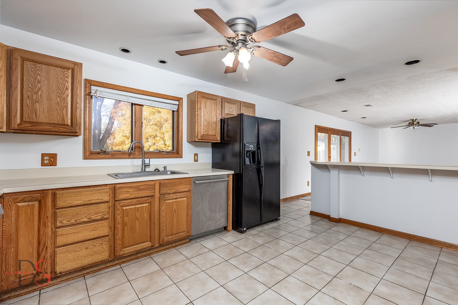 3060 Cemetery Road Morris, IL 60450 - Photo 7 of 24 a kitchen with a refrigerator sink and cabinets