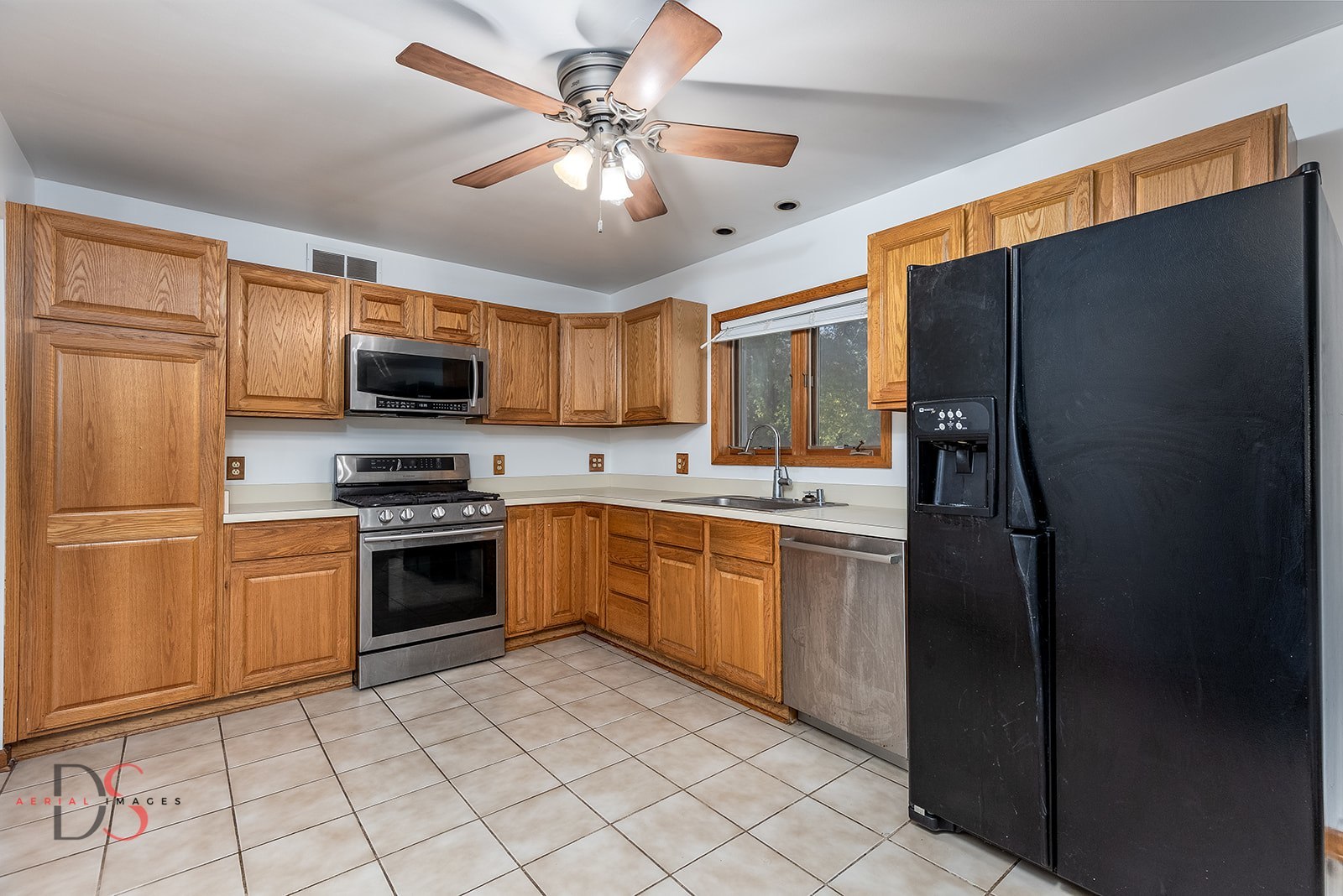 3060 Cemetery Road Morris, IL 60450 - Photo 8 of 24 a kitchen with stainless steel appliances granite countertop a refrigerator a stove a sink and a microwave