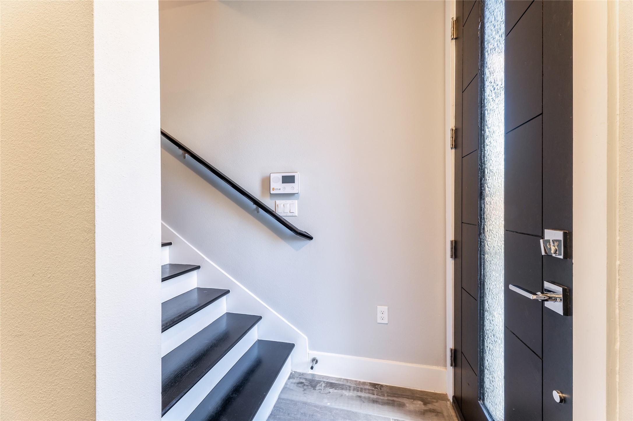 1417 Kramer Lane, Unit 9 Austin, TX 78758 - Photo 13 of 40 Entryway with baseboards and wood finished floors