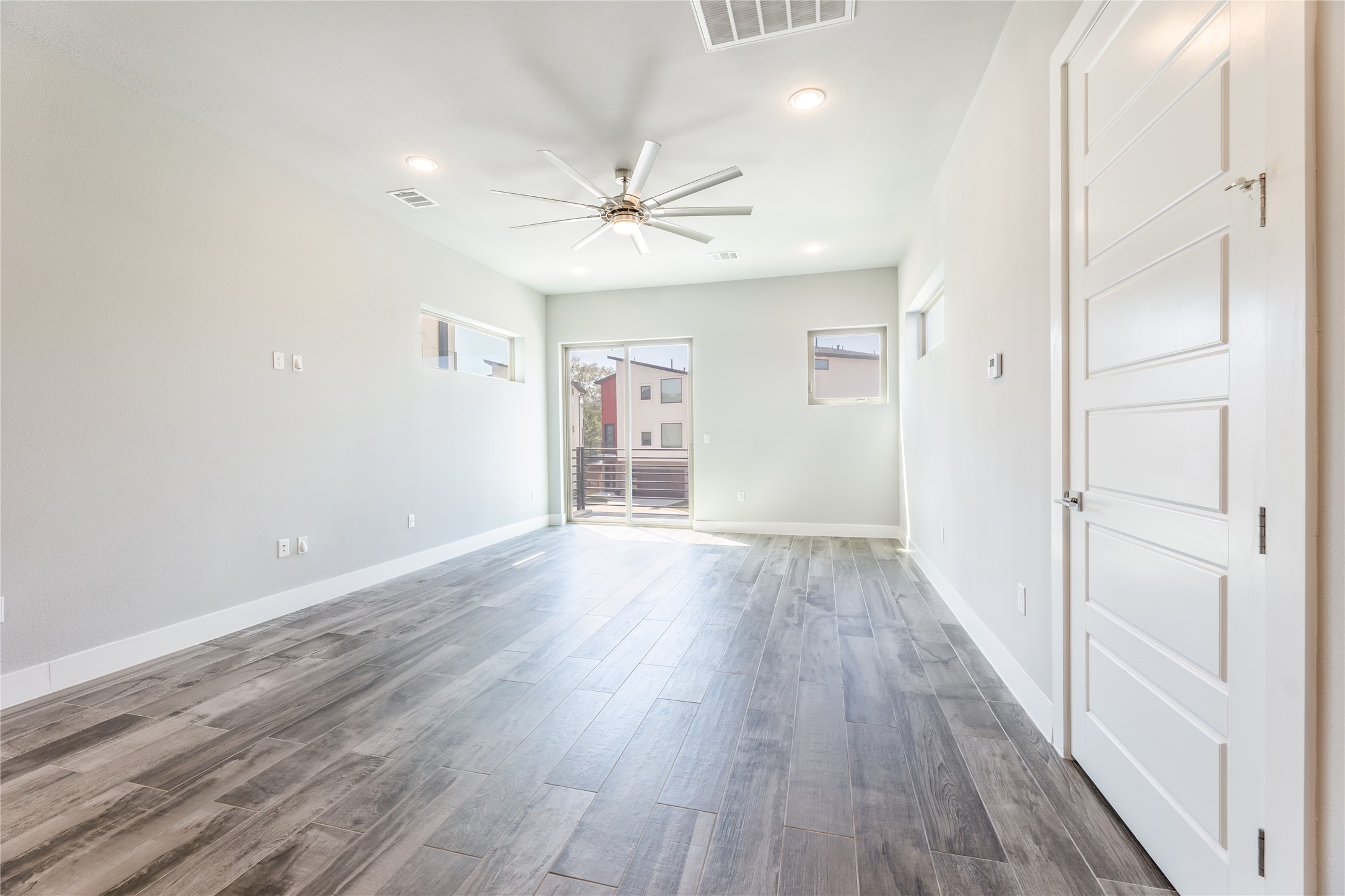 1417 Kramer Lane, Unit 9 Austin, TX 78758 - Photo 16 of 40 Unfurnished room with dark wood-style flooring, ceiling fan, and recessed lighting