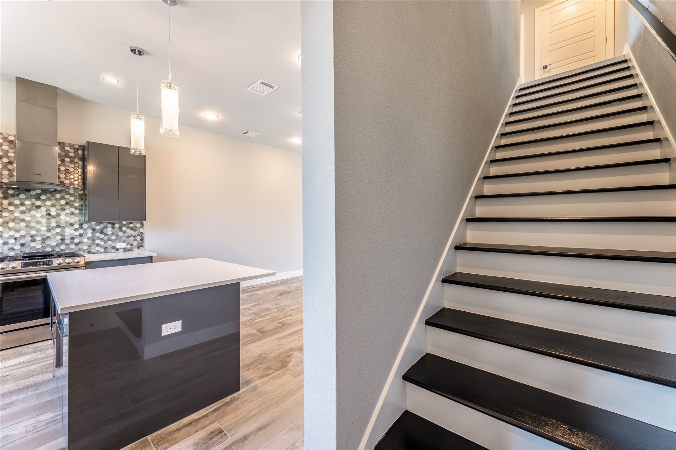 1417 Kramer Lane, Unit 9 Austin, TX 78758 - Photo 27 of 40 Staircase featuring wood finished floors