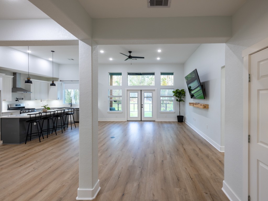 111 V Allen Lane Coldspring, TX 77331 - Photo 11 of 35 a view of kitchen with kitchen island wooden floor and stainless steel appliances