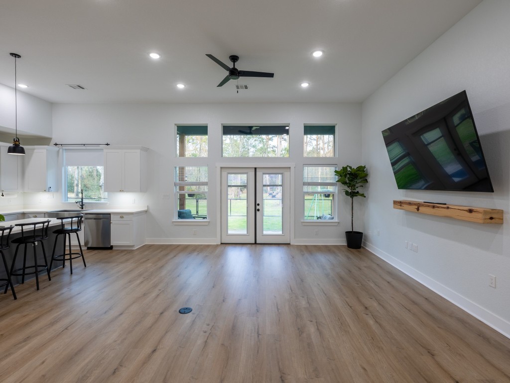 111 V Allen Lane Coldspring, TX 77331 - Photo 12 of 35 an empty room with wooden floor and windows