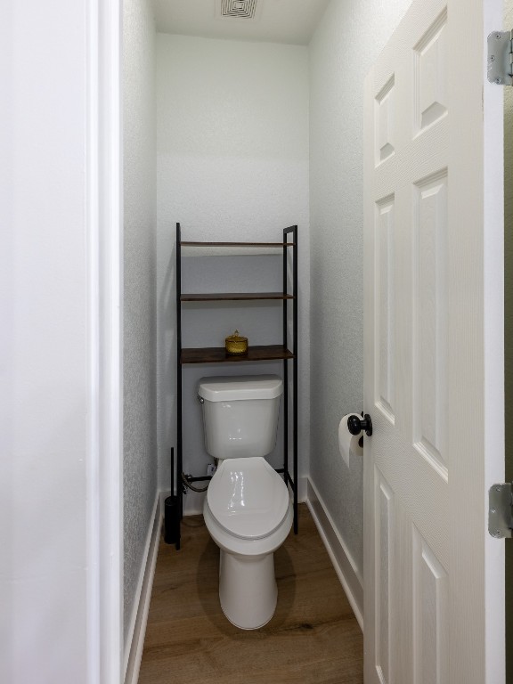 111 V Allen Lane Coldspring, TX 77331 - Photo 16 of 35 a white toilet sitting in a bathroom next to a sink