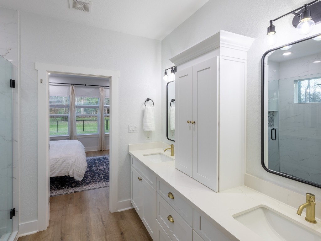 111 V Allen Lane Coldspring, TX 77331 - Photo 18 of 35 a spacious bathroom with a sink double vanity and a mirror