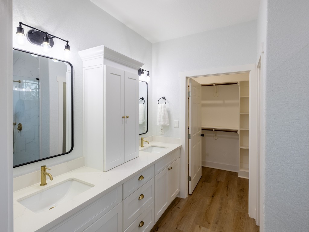 111 V Allen Lane Coldspring, TX 77331 - Photo 19 of 35 a spacious bathroom with a double vanity sink mirror and double