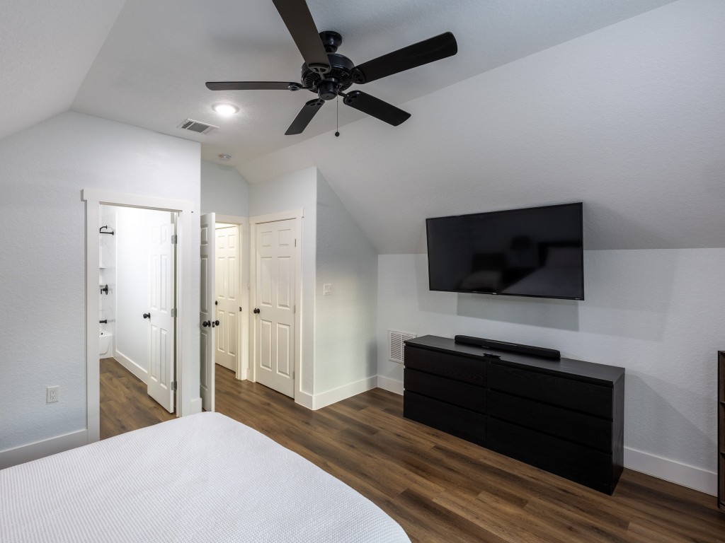 111 V Allen Lane Coldspring, TX 77331 - Photo 23 of 35 a bedroom with a bed and a television