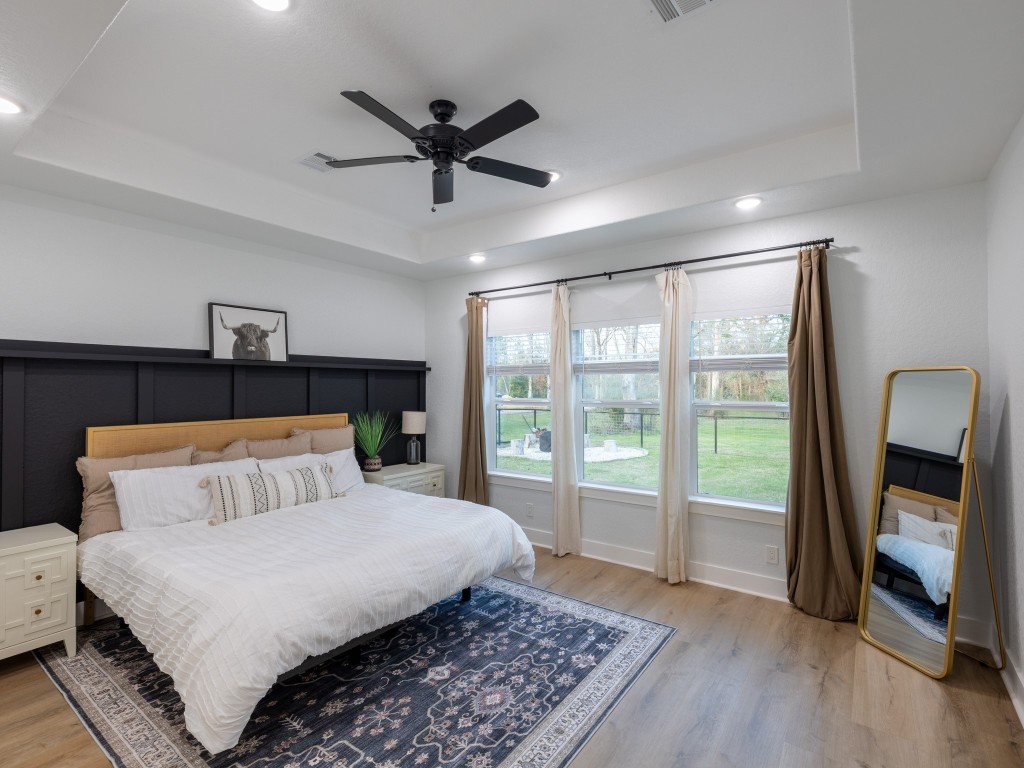 111 V Allen Lane Coldspring, TX 77331 - Photo 3 of 35 a bedroom with a large bed and a large window