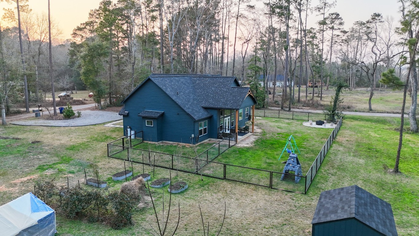 111 V Allen Lane Coldspring, TX 77331 - Photo 31 of 35 a view of house with backyard and outdoor seating