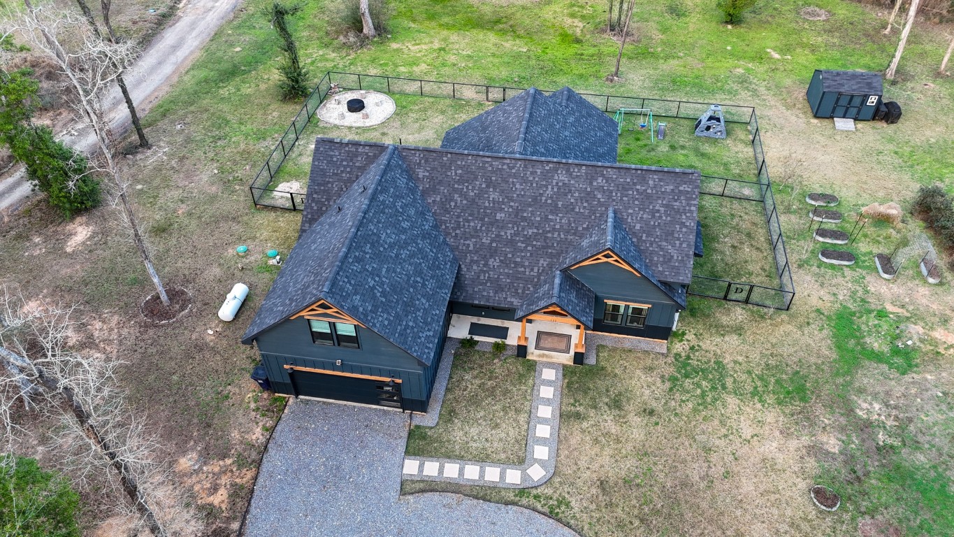 111 V Allen Lane Coldspring, TX 77331 - Photo 32 of 35 an aerial view of a house with a yard