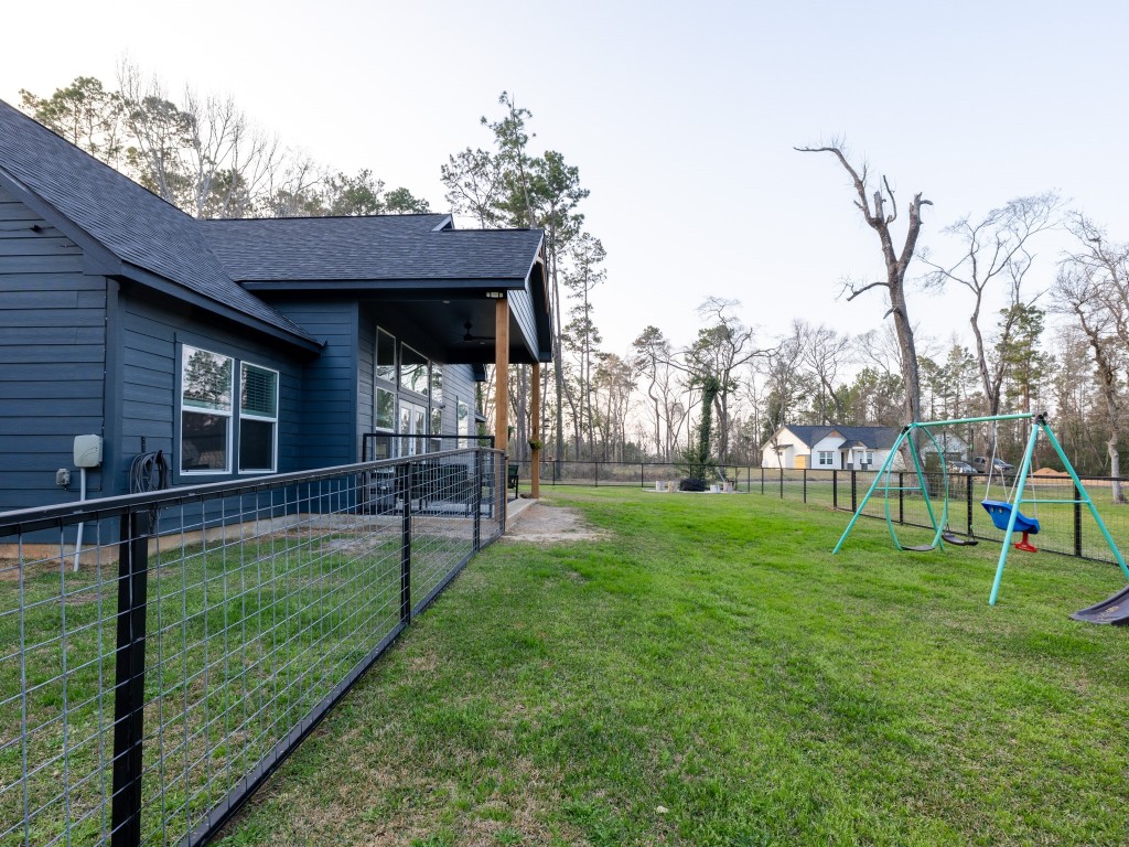 111 V Allen Lane Coldspring, TX 77331 - Photo 34 of 35 a view of a backyard with a garden