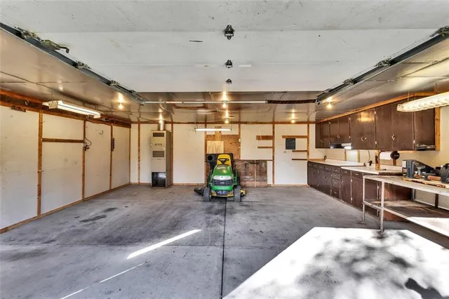 a kitchen with a refrigerator and a sink