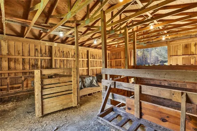 a view of an empty room with wooden walls