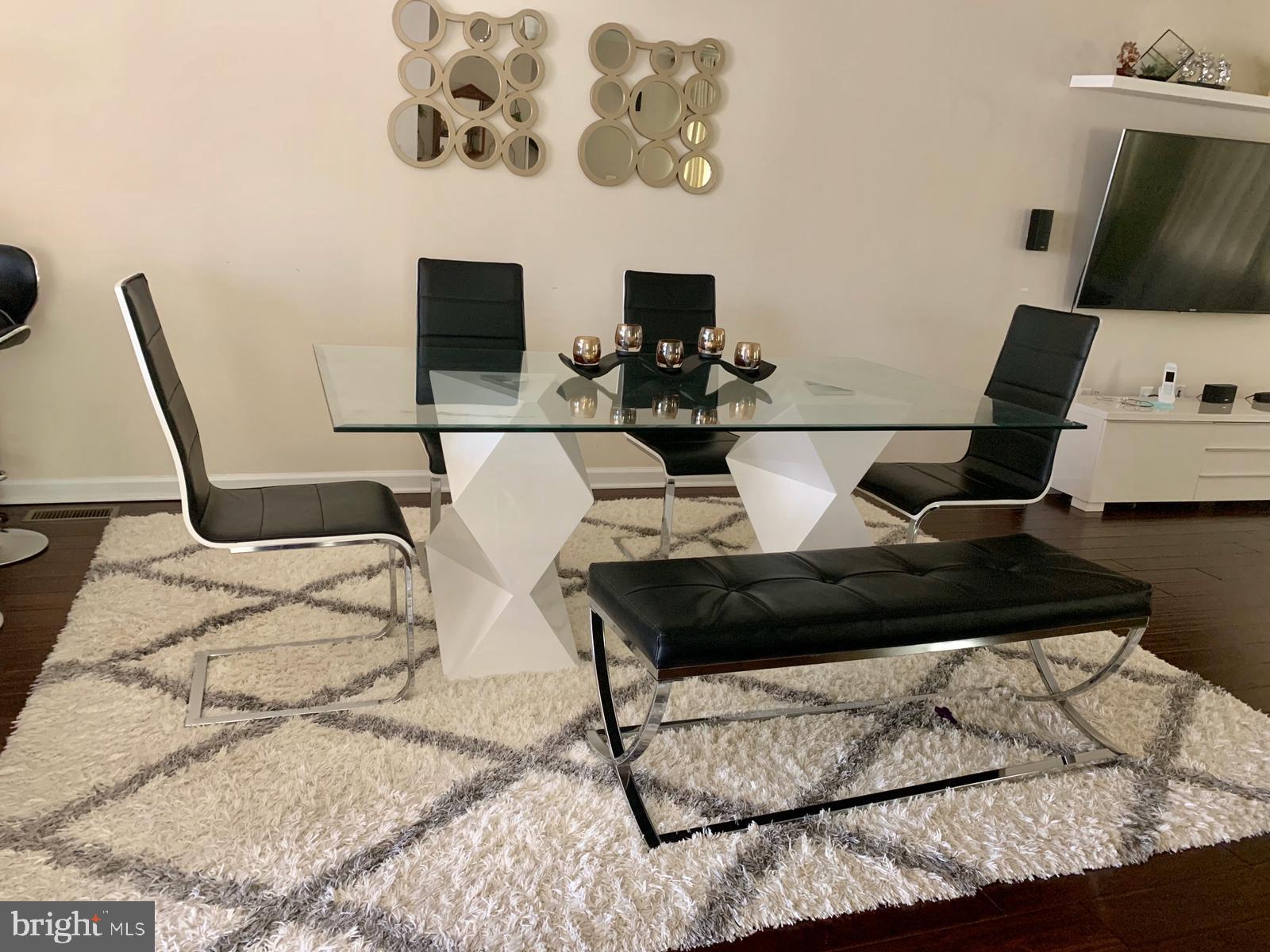 7014 Foxton Way Hanover, MD 21076 - Photo 11 of 29 Modern elegance in a chic dining space.