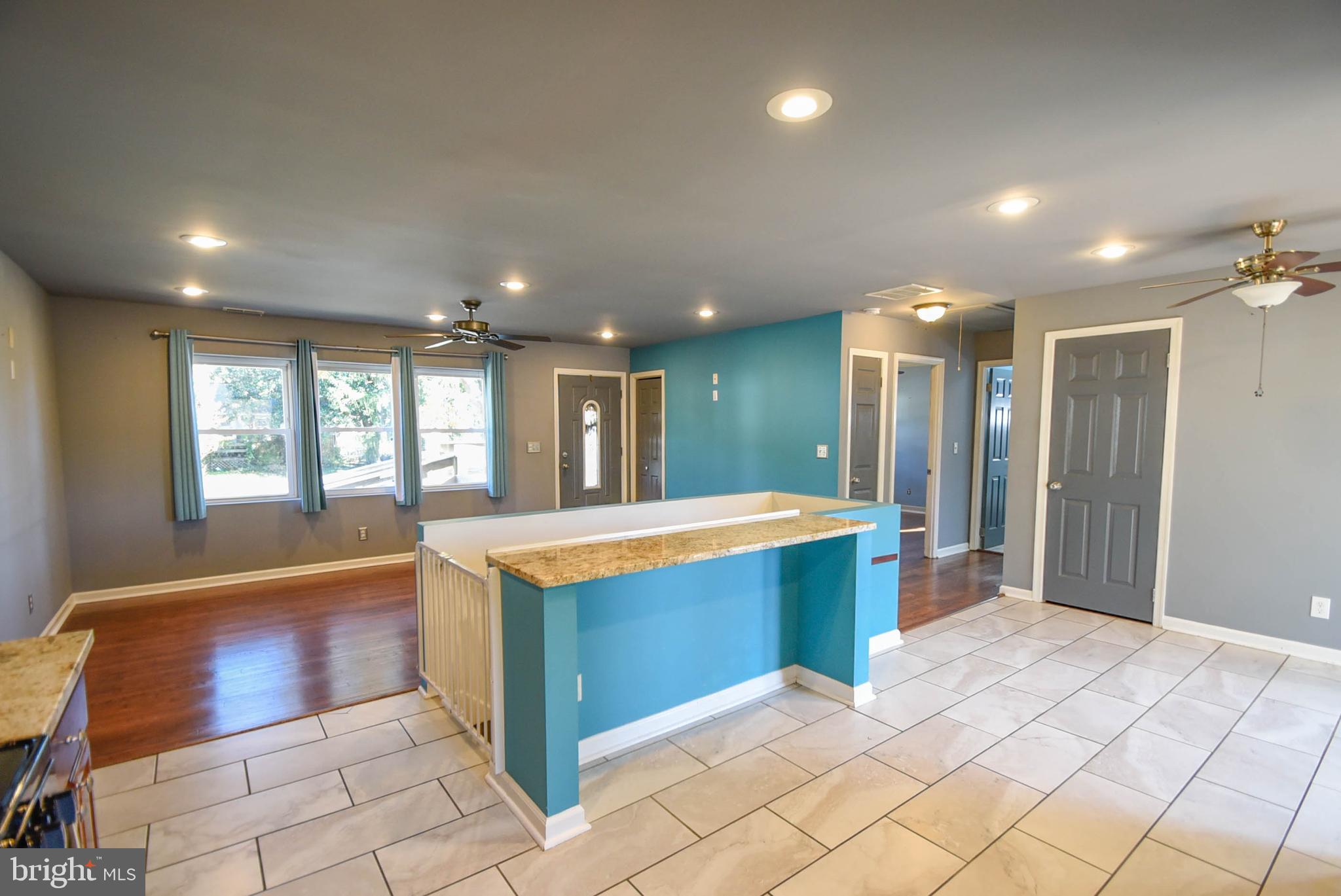 202 Embleton Road Owings Mills, MD 21117 - Photo 7 of 28 a large kitchen with kitchen island granite countertop a large window