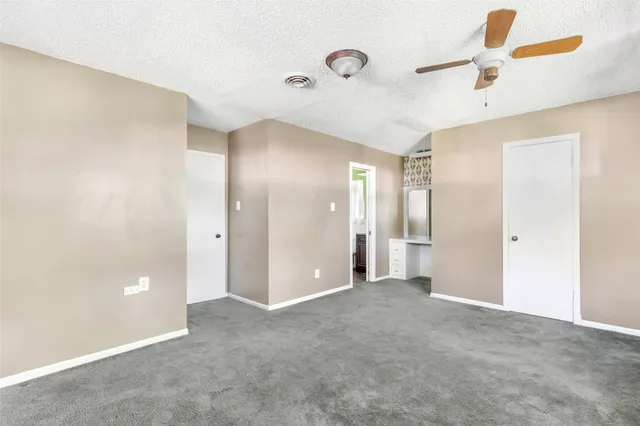 a bathroom with a sink mirror vanity and toilet