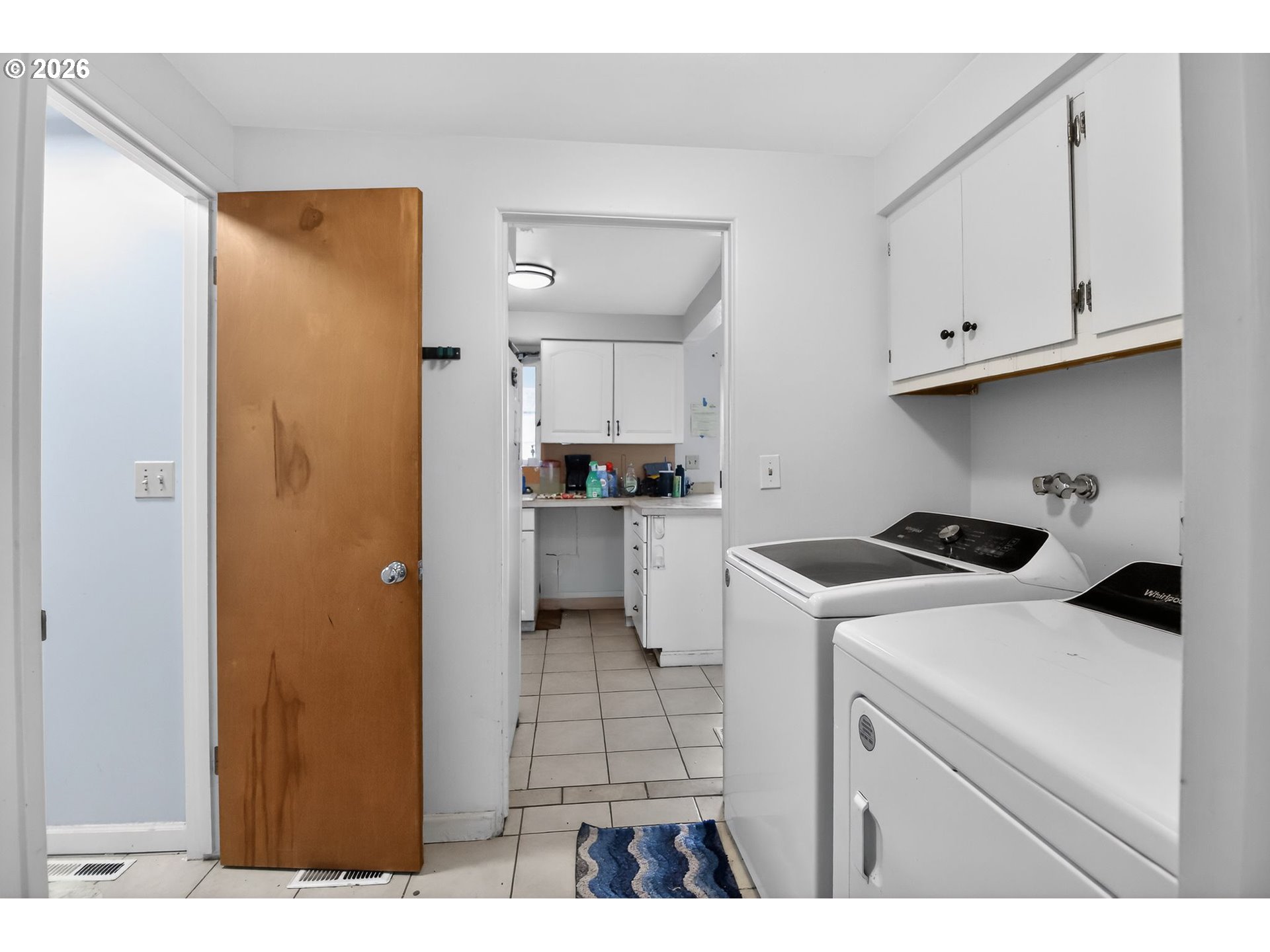 376 Northeast Chestnut Street Madras, OR 97741 - Photo 14 of 26 a kitchen with a refrigerator and cabinets